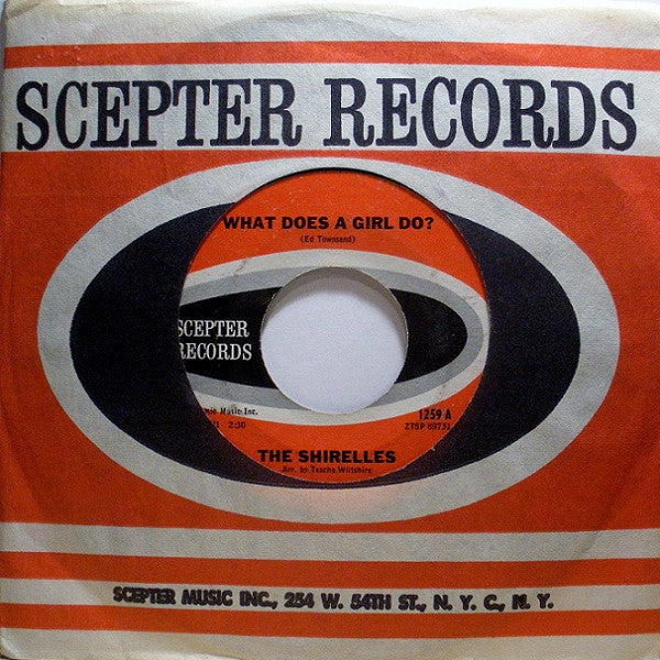 The Shirelles : What Does A Girl Do? (7", Single)